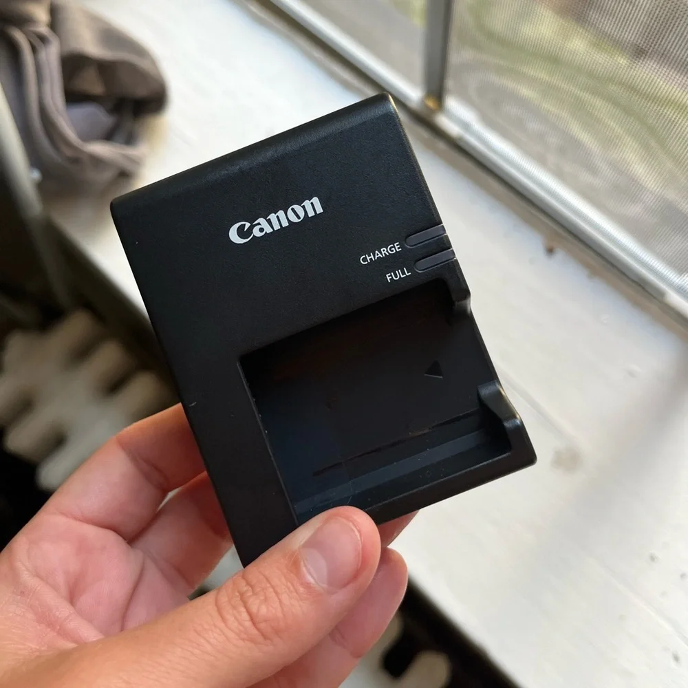 Canon Camera with case, charger, zoom lens and SD card to Apple converter